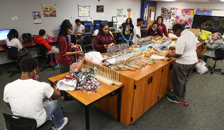 Bowman students weave mats for the homeless