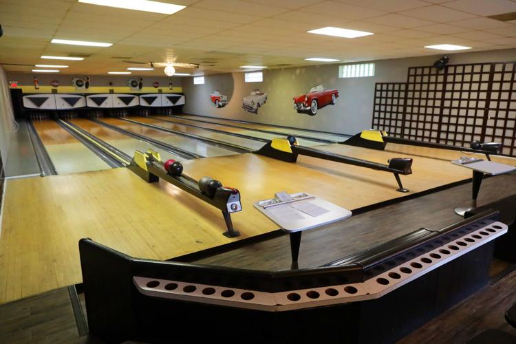 Manual scoring, vintage pinsetters keep bowling alley right at home