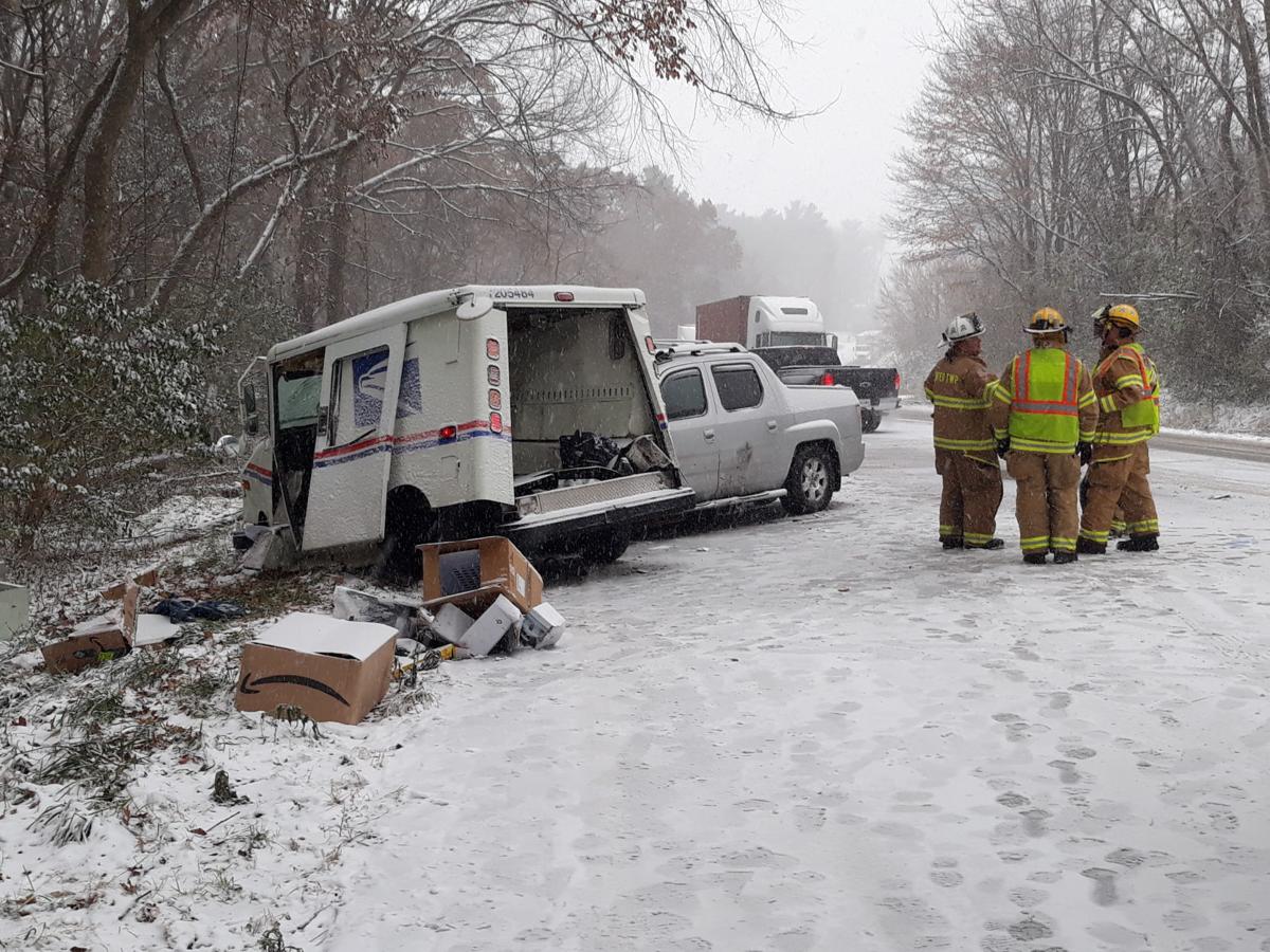 Accident involving mail truck spills packages on roadside near LaPorte
