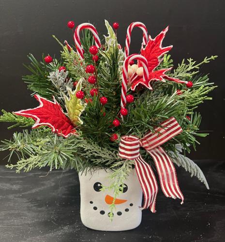 Florists start with the green and add the feelings to create holiday magic