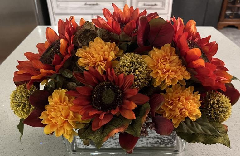 Fall flowers and accents make a festive statement on Thanksgiving table
