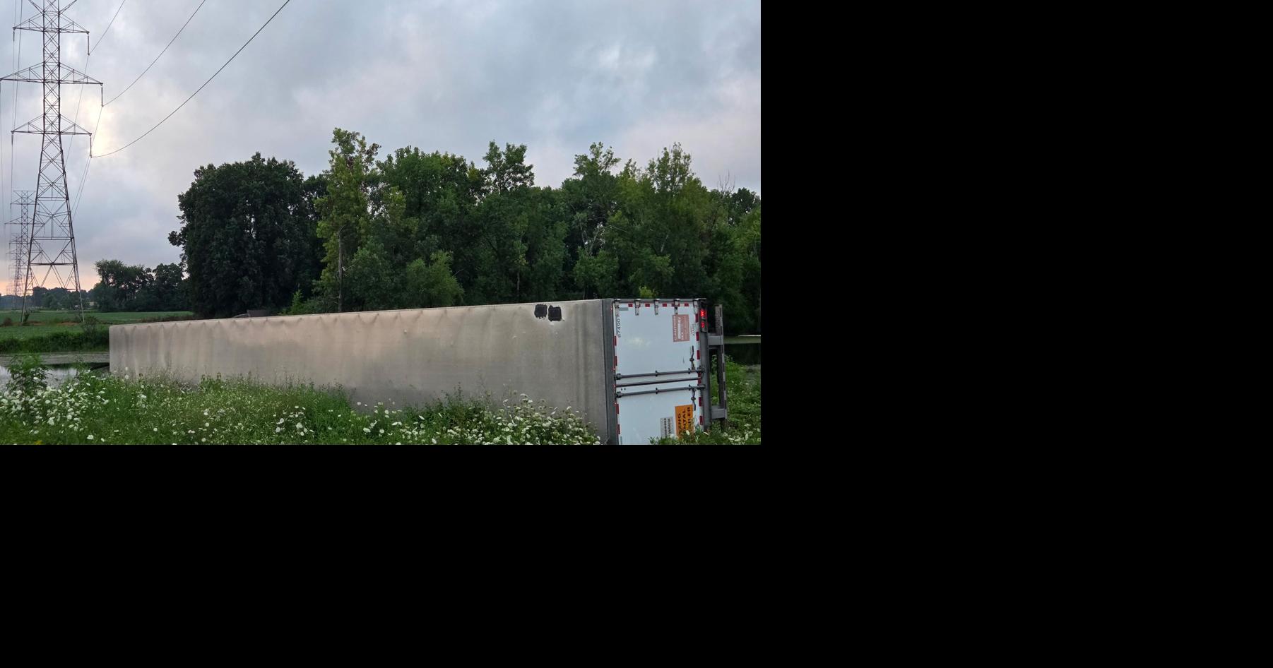 Semi-trailer overturns in pond alongside Indiana Toll Road