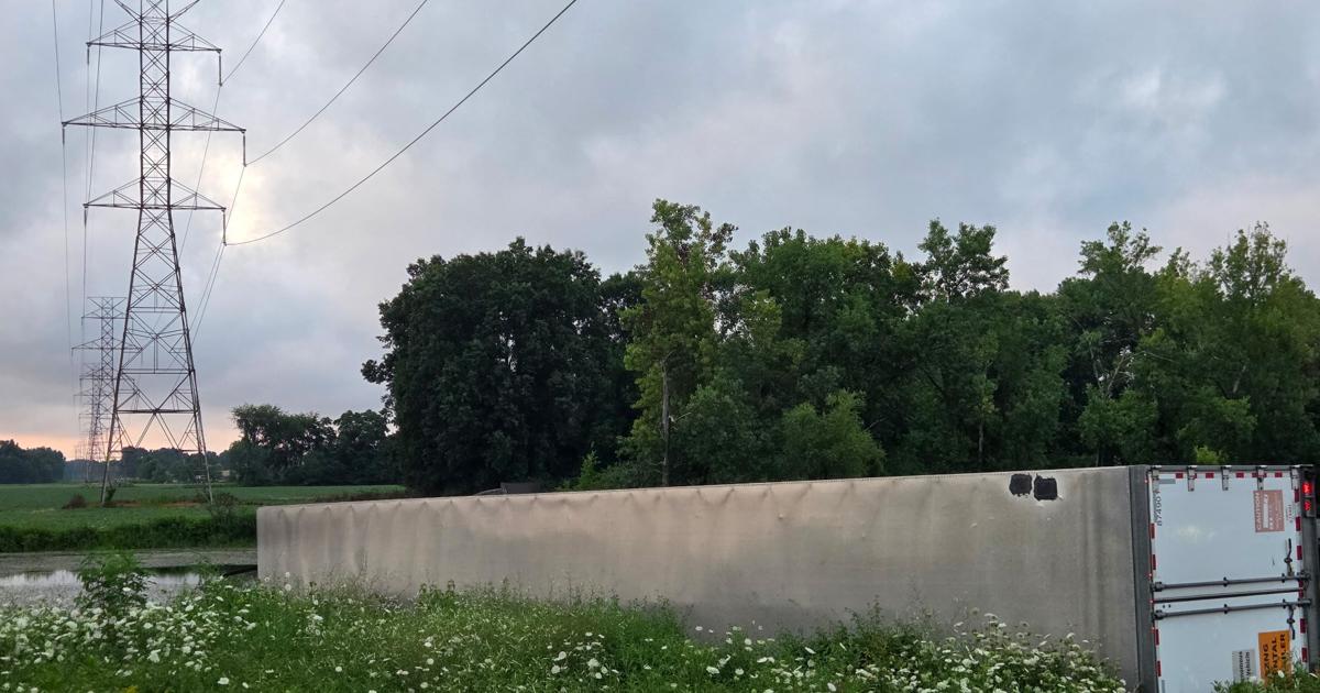 Semi-trailer overturns in pond alongside Indiana Toll Road