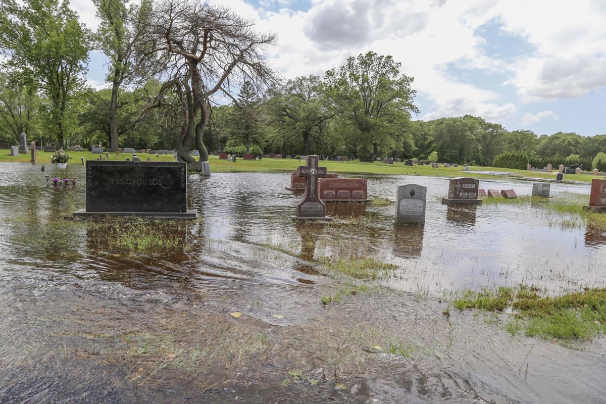 WATCH NOW Severe flooding at Region cemetery leaves gravestones under