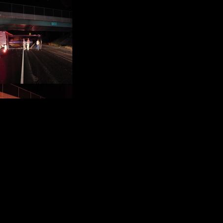Truck driver forgets to lower dump trailer, hits bridge