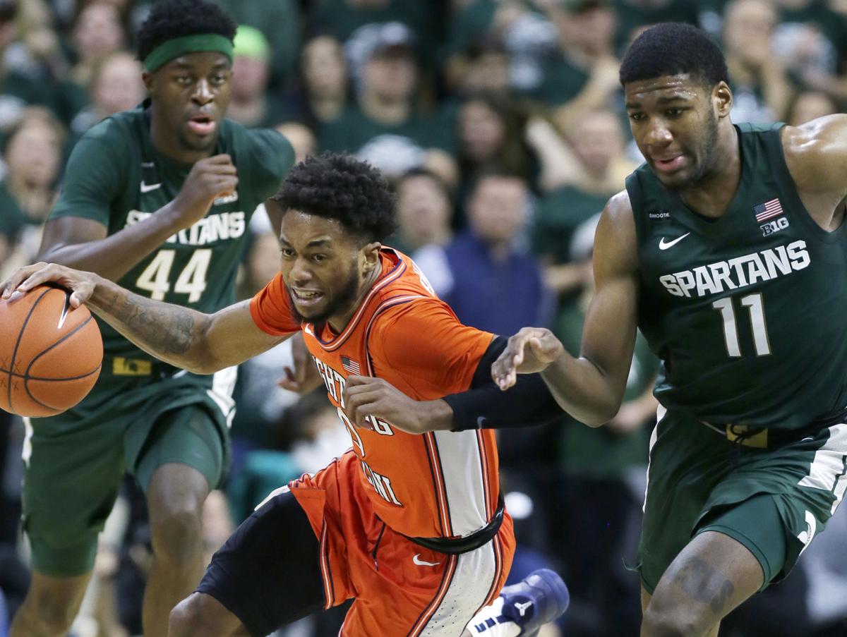 On January 2, 2020, Illinois' Alan Griffin is pursued down court by Michigan State's Gabe Brown (44) and Aaron Henry (11) during the second half at Breslin Center in East Lansing, Mich.