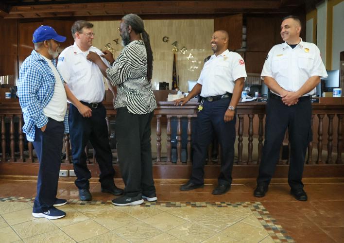 Fireﬁghters being honored and their new positions