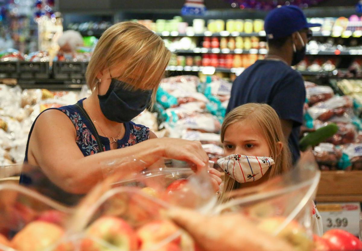 Retailers and municipalities require face masks