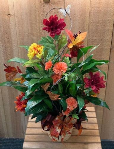 Fall flowers and accents make a festive statement on Thanksgiving table