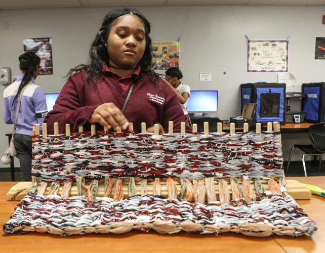 Bowman students weave mats for the homeless