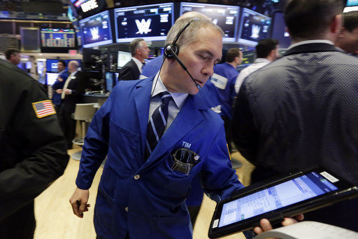 Stocks pare their losses as health care companies climb