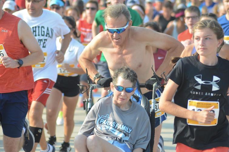 300th race in the books for husband on foot and wife in wheelchair