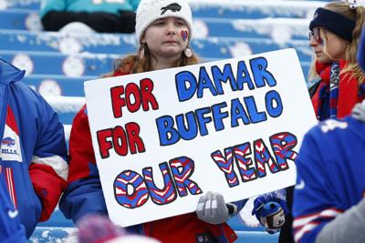 Bills' Hamlin says 'heart is with' team at game, he's home, Sports