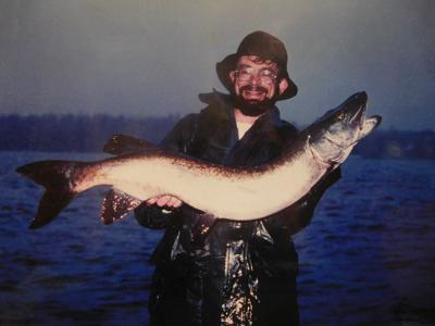 Reeling in a muskie on a rainy morning