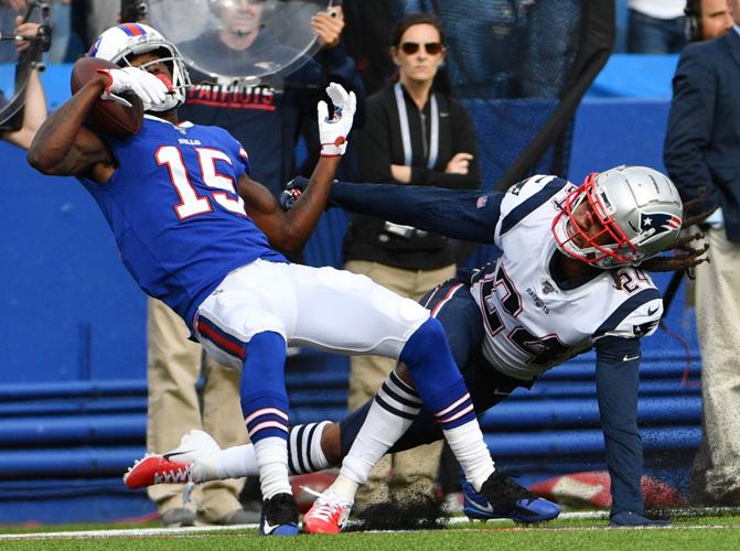 Patriots' defense, running game hold off Bills in bad-weather bowl