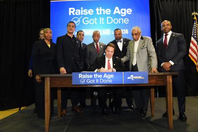 Governor Andrew M. Cuomo signs Raise the Age into law in Harlem on April 10, 2017