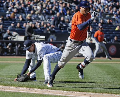 Correa's dribbler boosts Astros over Yanks 5-3 in opener