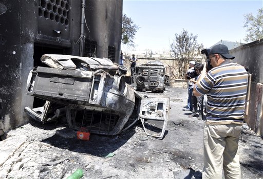 Syria burnt police car