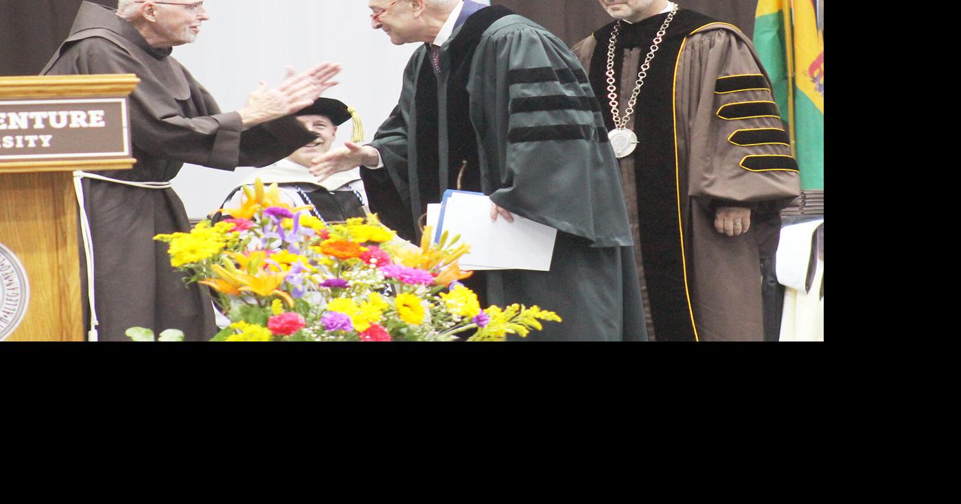 Fr. Riley honored with doctorate, surprise Schumer speech at St