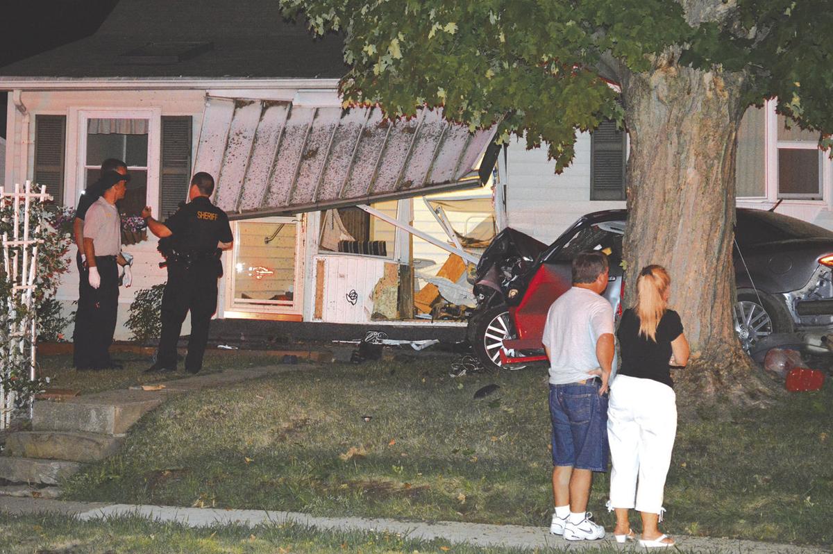 Man hospitalized after car slams into Seneca Avenue home News