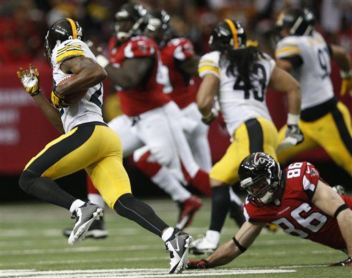 Pittsburgh Steelers Hines Ward (86) pulls in a pass from quarterback Ben  Roethlisberger during the first