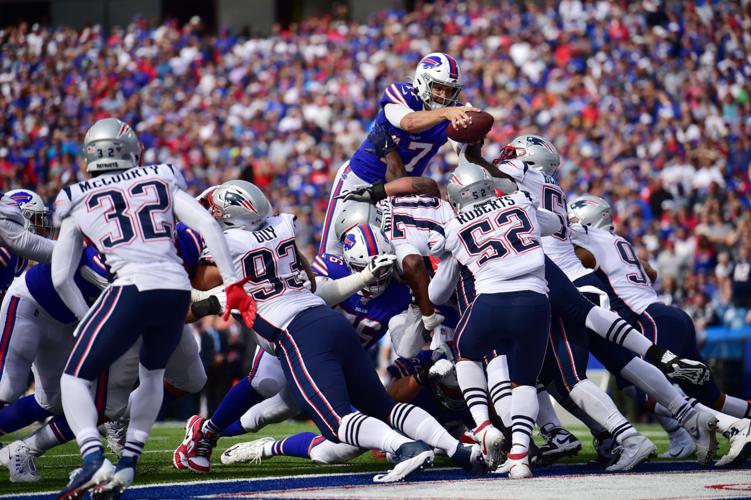 Patriots' defense, running game hold off Bills in bad-weather bowl