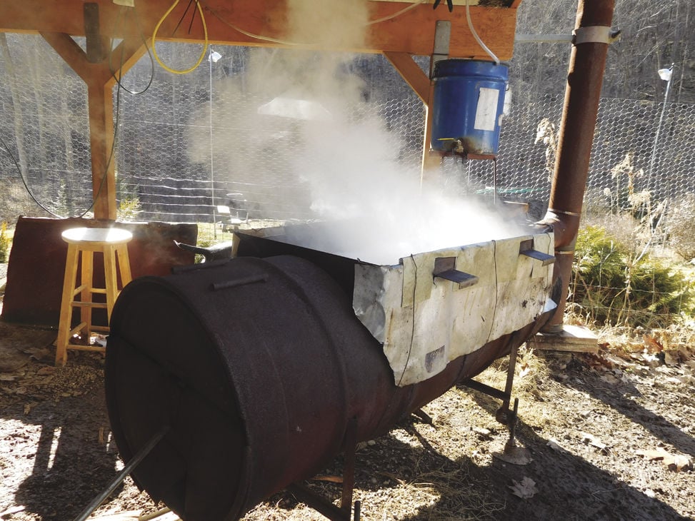 A Wood Fire Has The Tray Of Maple Sap Boiling Briskly As Cloud Steam Shows It Takes 35 To 50 Gallons Make 1 Gallon Syrup