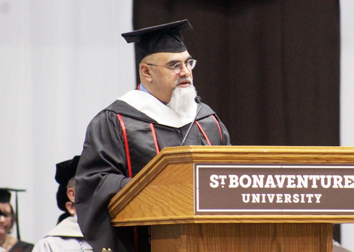 Fr. Riley honored with doctorate, surprise Schumer speech at St