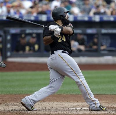 Pittsburgh Pirates Pedro Alvarez tosses his bat and walks to first