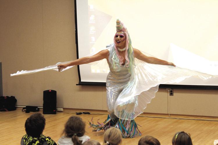 Drag queen performs lap dance on student and gyrates in front of cheering  children