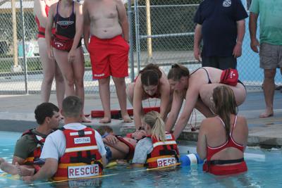 Joined by Onida Fire Department members, Onida lifeguards simulated a neck injury and rescue.