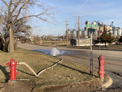 The new hydrant at the corner of 6th  Street and Ash Avenue was flushed Monday morning in preparation for making the new water mains operational.