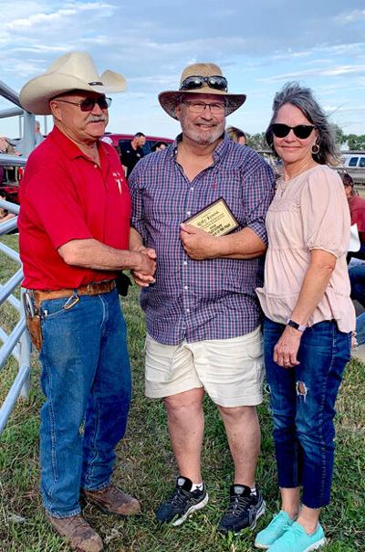 Sully County Fair Board President congratulates this year’s Friend of Fair, Rolly Kemink, pictured with his wife Colette.