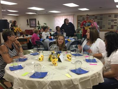Sunflowers decorated the Jacquot Carpentry table.