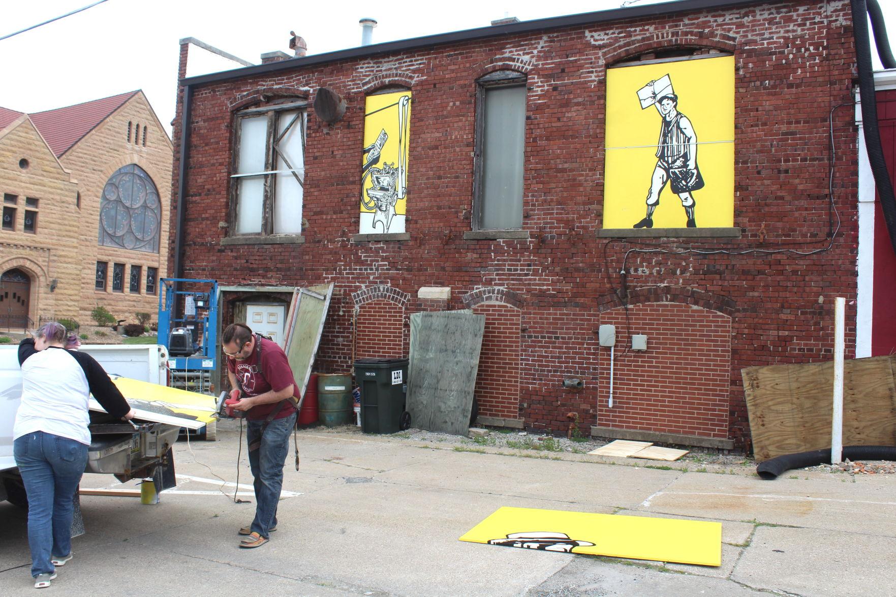Mural goes up on old Herald building