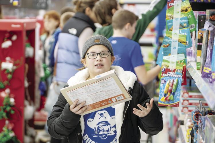 Kingsford Park students buy holiday gifts for those in need News