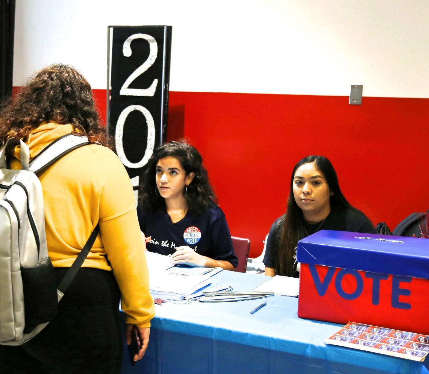 High school voters check in with Evelyz Rivera and Inez Sanchez