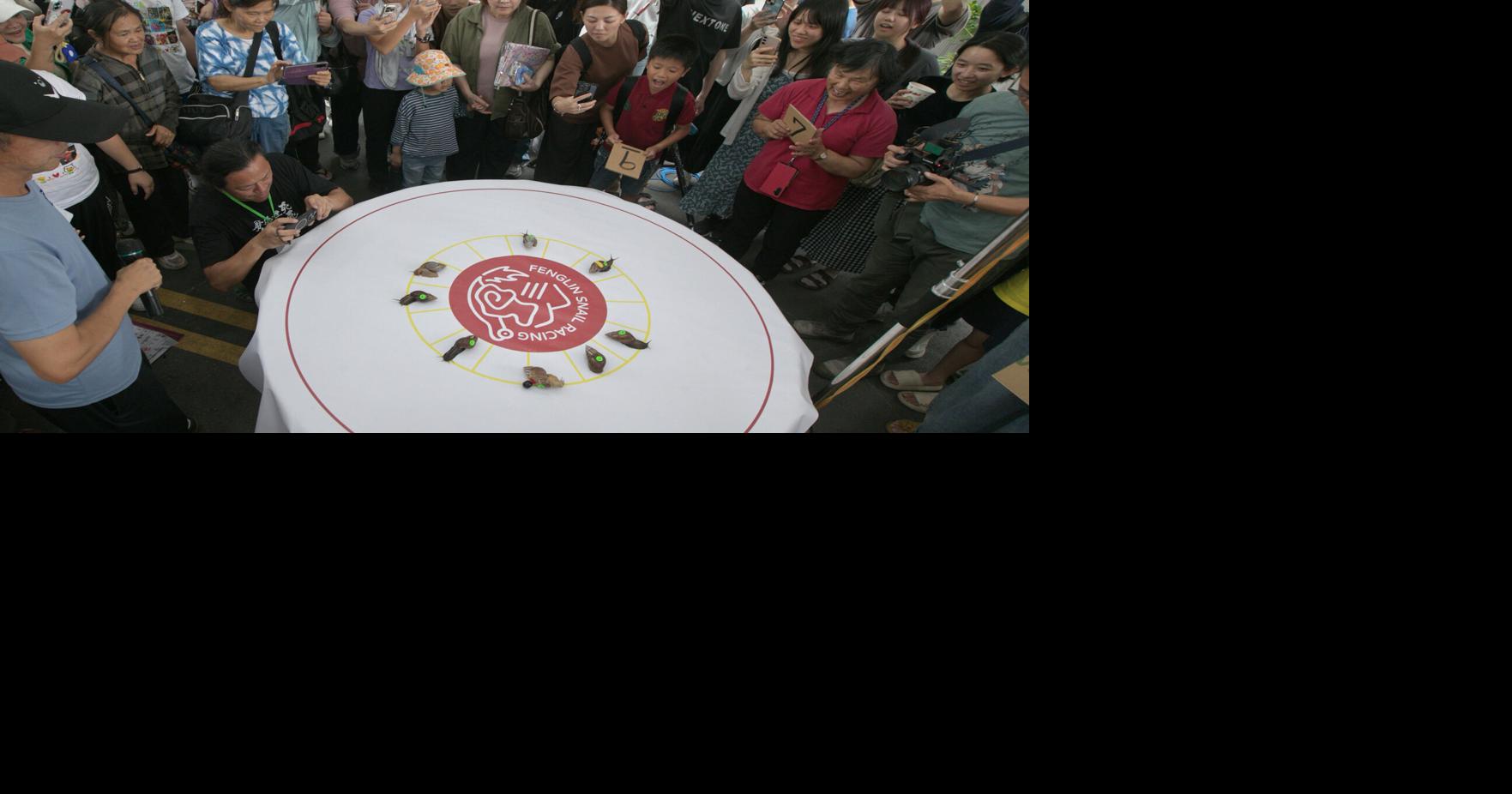 A Taiwanese town embraces a slow pace of life through a snail race
