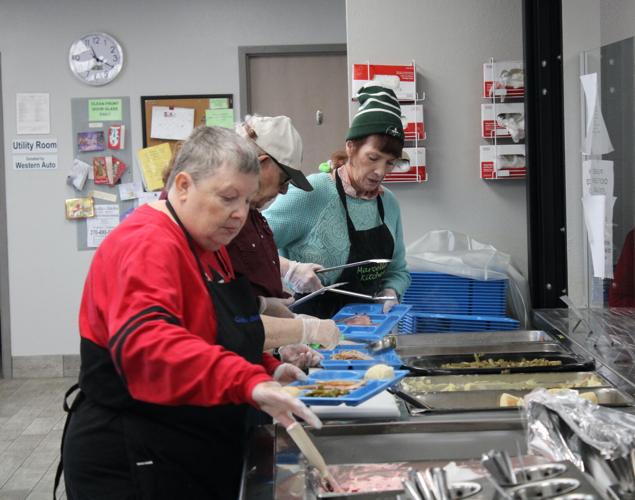 Marcella's Kitchen Christmas party feeds families News