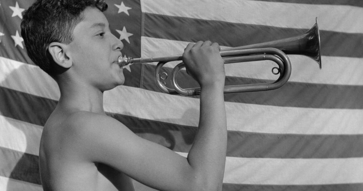 A camper blows a bugle at Camp Nathan Hale in upstate New York in 1943.