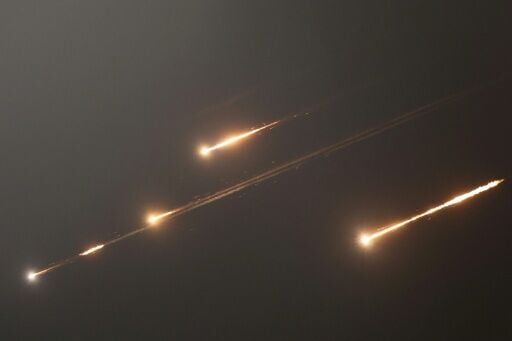 Rocket trails light up the skies over Jerusalem as Iran launches waves of missiles at Israel in response to its strikes on key nuclear and military facilities.
