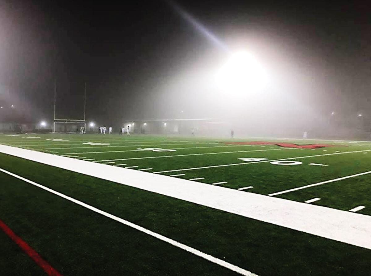 High school soccer Palestine boys play through, wins in the fog