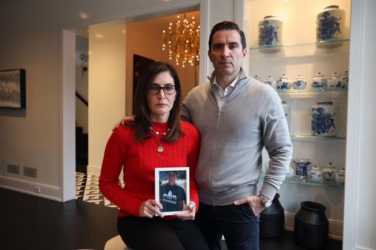 Rose and Robert Bronstein at home in Chicago with a photo of their son Nate on Tuesday, April 2, 2024. They are tackling the issue of cyberbullying after Nate’s death.