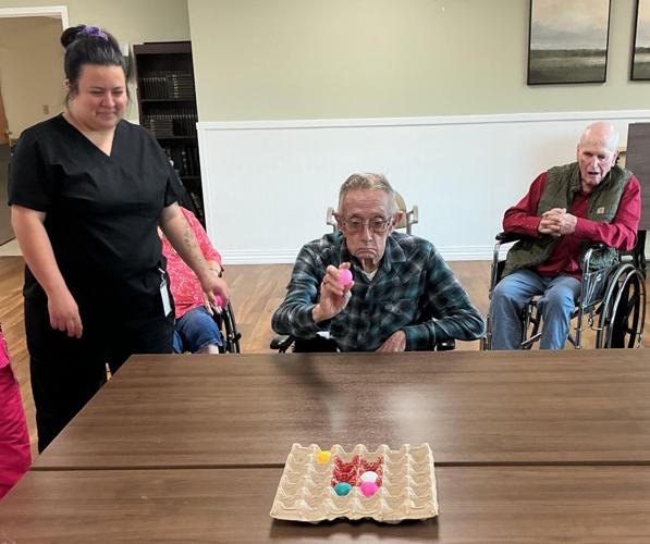 The determined look on resident, Charles Guy’s face as he aims to bounce the ball into the bullseye during the Minute to Win It competition.