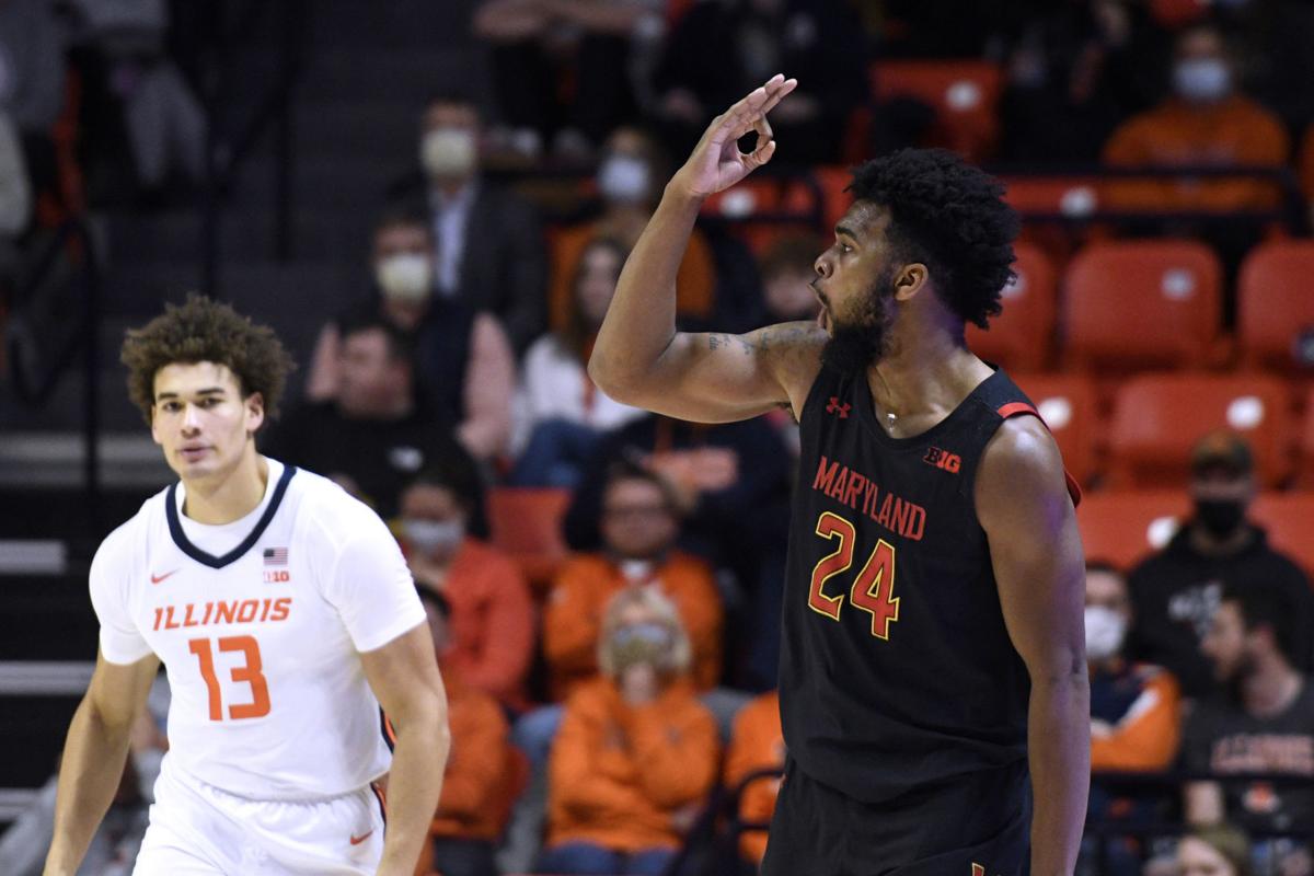 The jersey number of former Illinois player Ayo Dosunmu, now with the  Chicago Bulls, is retired during halftime of Illinois' NCAA college  basketball game against Maryland on Thursday, Jan. 6, 2022, in