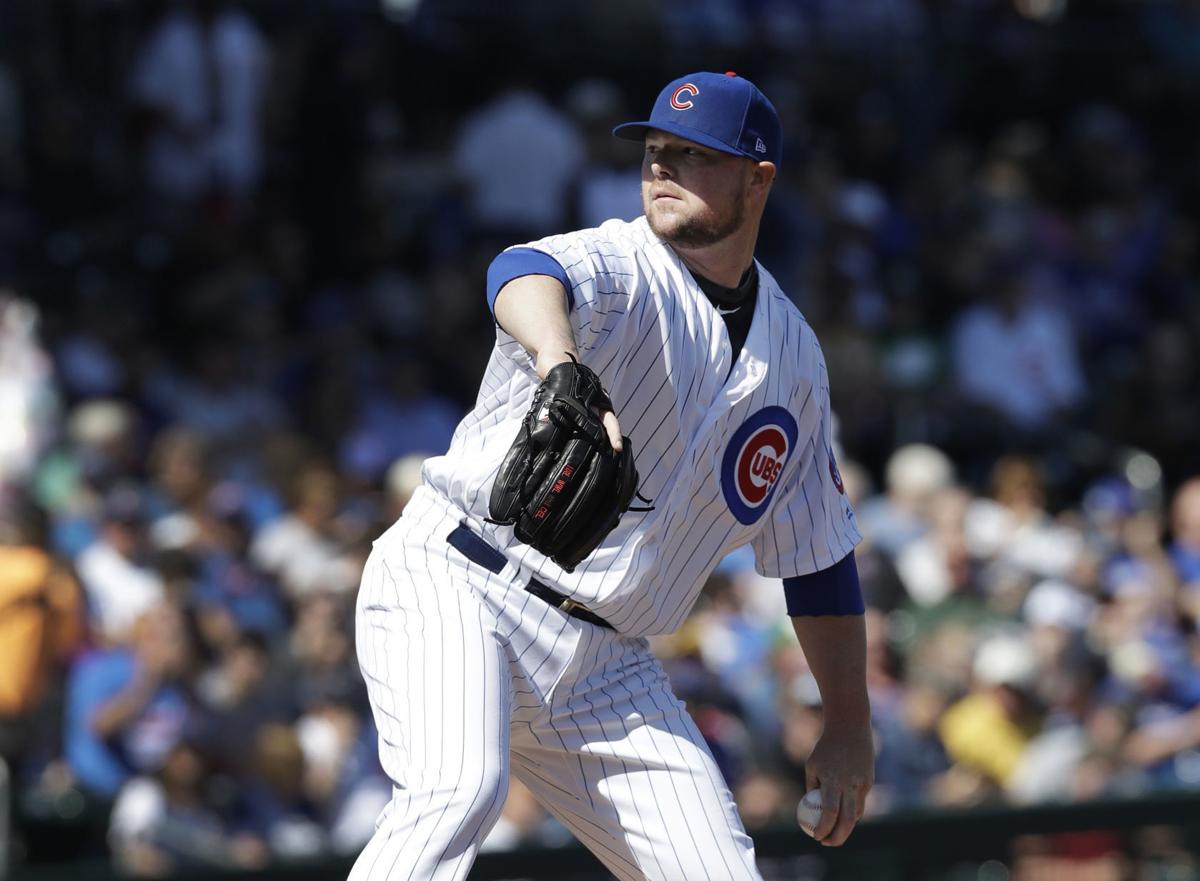 cubs lefty lester working on unusual bounce throw to bases