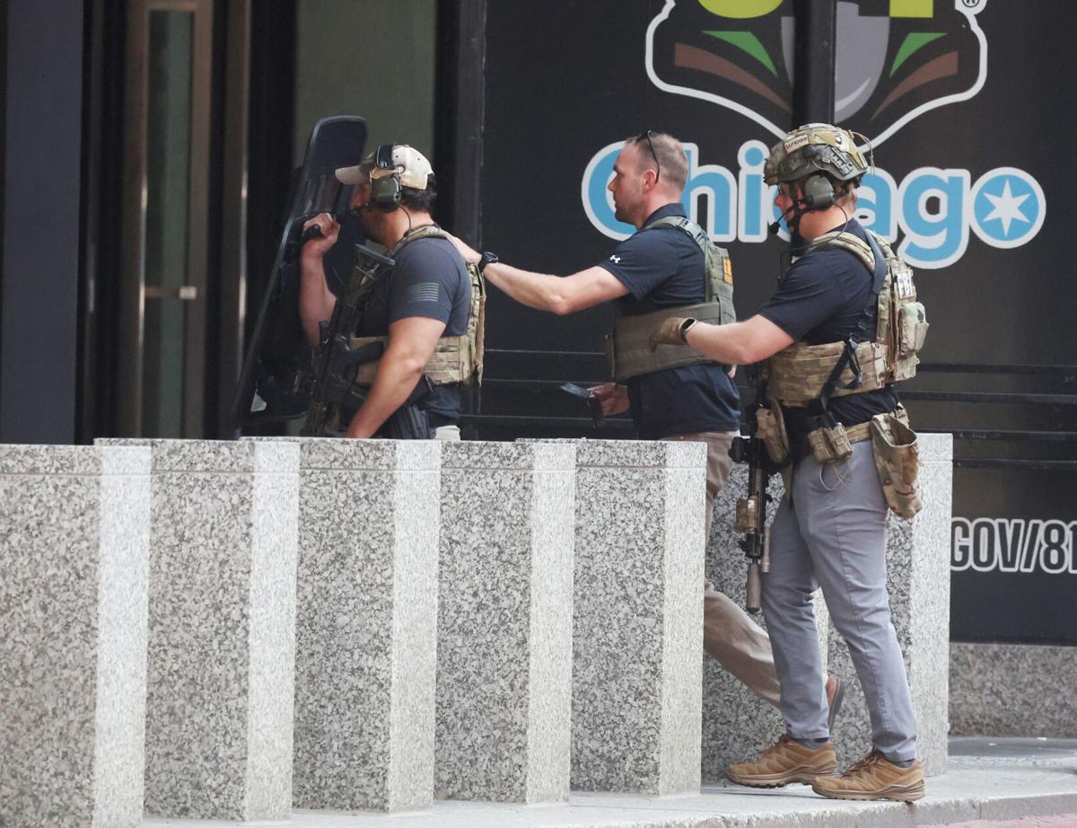 FBI agents enter the Dirksen U.S. Courthouse during a standoff between a man with a knife and law enforcement continue on July 22, 2025.