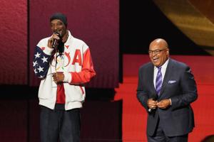 Ready to begin: Snoop Dogg gets in place to broadcast the Olympics