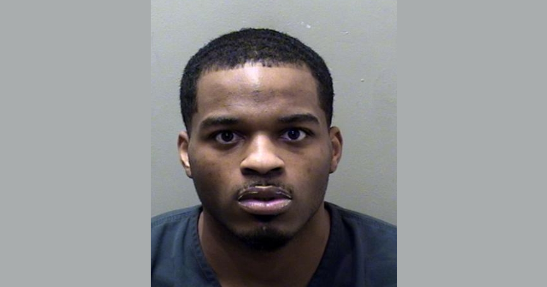 Bloomington man held in McLean County on gun charges