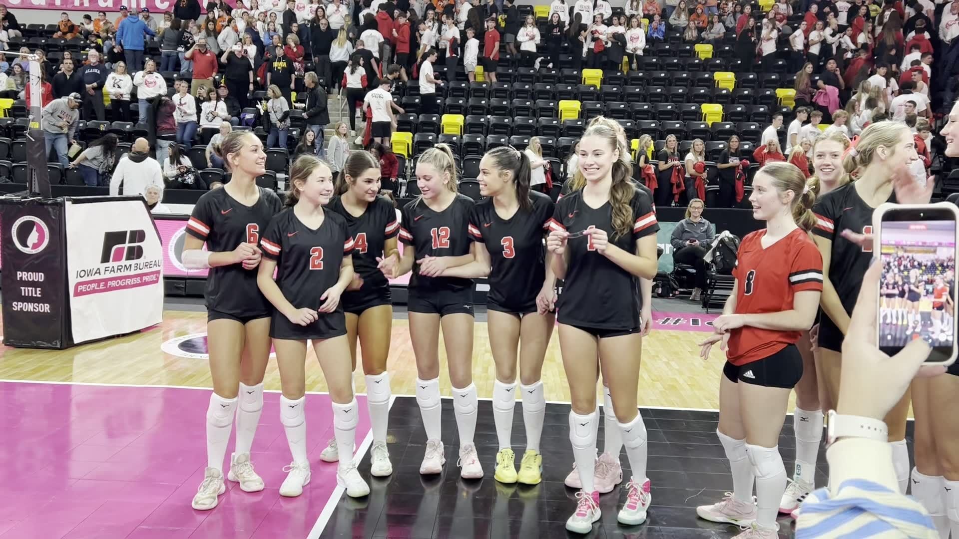 Assumption volleyball celebrates during its state quarterfinals win